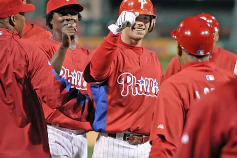 The Phillies' Jason Donald celebrates with teammates after hitting a walk off base hit with bases loaded in the bottom of the ninth against the Tampa Bay Rays to win the preseason game, 3-2, Friday. (Steven M. Falk / Staff Photographer)
