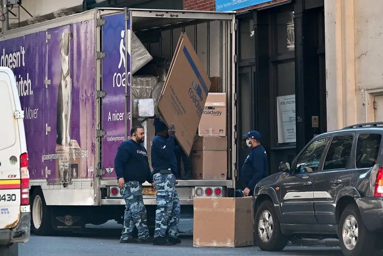 A moving crew is seen loading a truck in Manhattan in March. Pennsylvania Realtors have noticed an uptick in inquiries from New Yorkers.