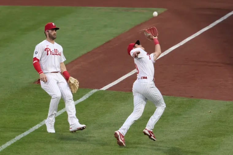 Phillies Bryce Harper watches Nick Maton try to chase down a fly ball during the NY Mets at Philadelphia Phillies MLB baseball game at Citizens Bank Park in Phila., Pa. on May 2, 2021.