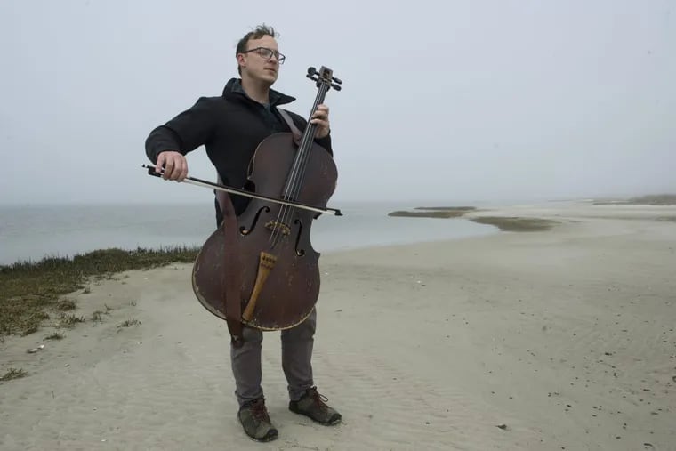 Ben Sollee plays his  cello on the Long Beach Island portion of the Edwin B. Forsythe National Wildlife Refuge in New Jersey. He’s composing a ‘songscape’ about the refuge.