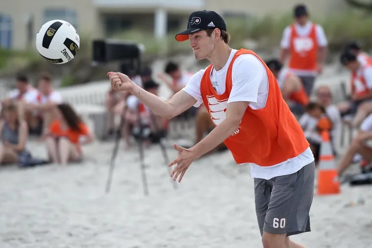 Flyers' 2018 first round draft pick forward Joel Farabee serves during a volleyball game at the Flyers' annual "Trial at the Isle" in Stone Harbor, N.J. June 27, 2018. TOM GRALISH / Staff Photographer