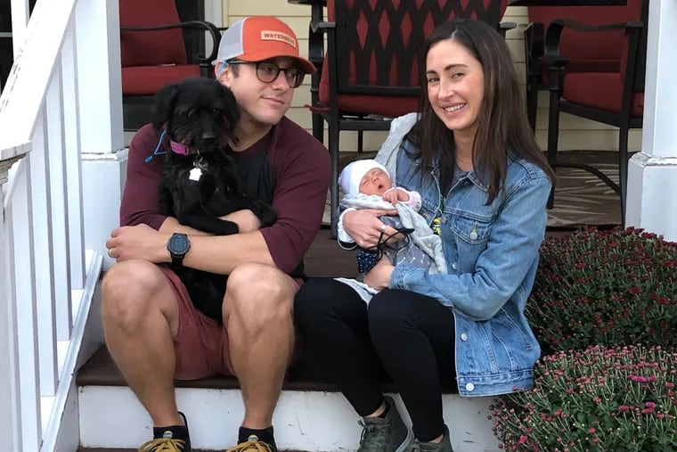 Sean and Katy with their Labradoodle, Aria, and their daughter Helen.