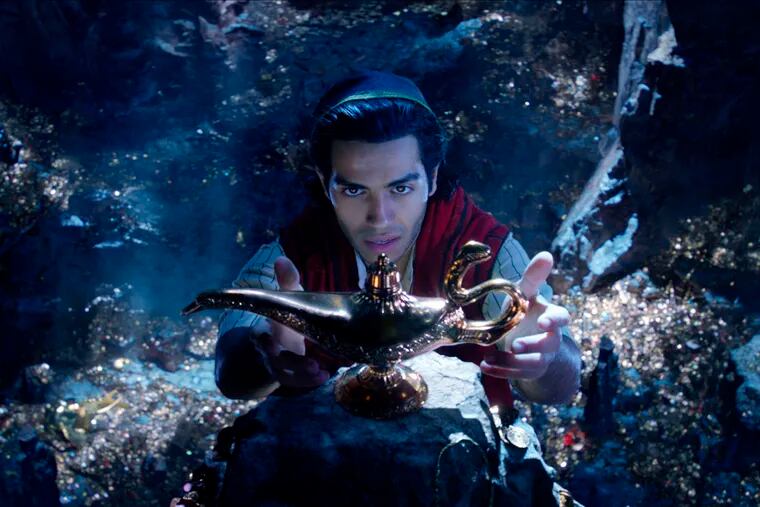 This image released by Disney shows Mena Massoud as Aladdin in Disney's live-action adaptation of the 1992 animated classic "Aladdin." (Disney via AP)