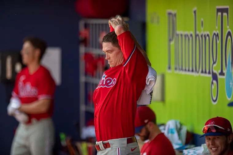 Philadelphia Phillies starting pitcher Kyle Gibson stretches in the dugout during the 1st inning against the Atlanta Braves at CoolToday Park in North Port, Fla.