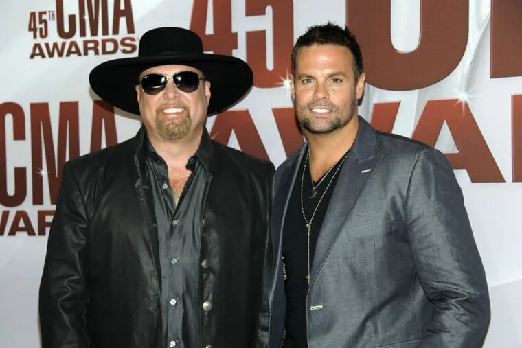 Troy Gentry (right) and Eddie Montgomery of Montgomery Gentry arrive at the 45th Annual CMA Awards in Nashville on Wednesday, Nov. 9, 2011.