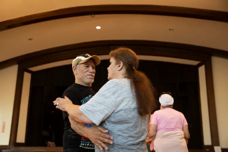 Orlando and Maria Hernandez, from Camden, dance together during ballroom dance lessons for the blind and visually impaired at Grace Episcopal Church in Haddonfield, N.J.