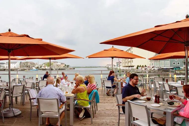 Patrons dining alfresco at the Water Star Grille at the Reeds in Stone Harbor. (DAVID M WARREN / Staff Photographer)