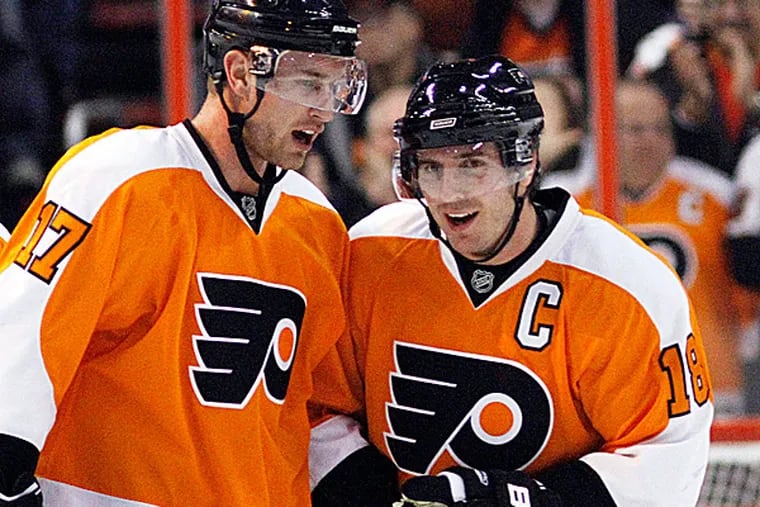 Former Flyers Jeff Carter and Mike Richards.