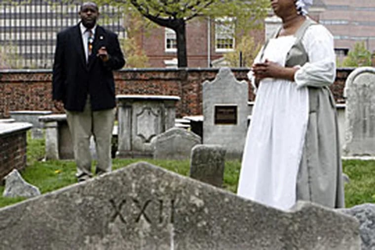 Jabbar Wright gives a tour of the Christ Church graveyard at 3rd and Arch Streets in Philadelphia. Re-enactor Diane M. Johnson plays Sarah, a slave in Philadelphia who mourns for people that died of yellow fever. (Bonnie Weller/Inquirer)