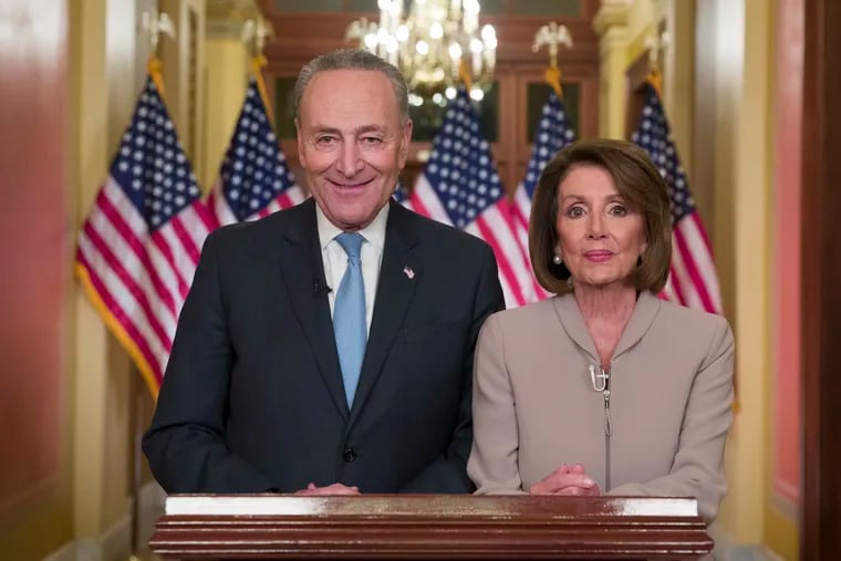 Senate Minority Leader Chuck Schumer of N.Y., and House Speaker Nancy Pelosi of Calif., pose for photographers after speaking on Capitol Hill in response President Donald Trump's address, Tuesday, Jan. 8, 2019, in Washington.
