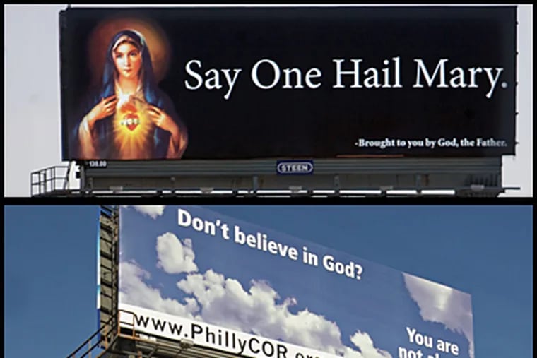A billboard (top) that's been erected on I-95 with a photo of the Virgin Mary says: "Say One Hail Mary. - Brought to you by God, the Father."  It replaces a billboard doubting God's existence.