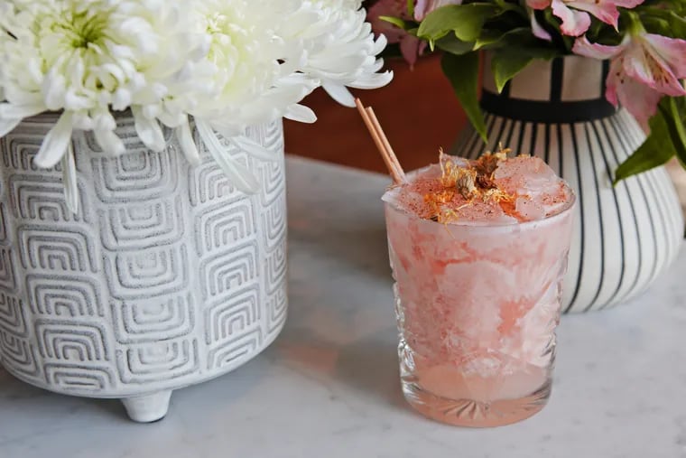 The Painted Sunflower at CO-OP Restaurant & Bar is made with KLYR rum, Aperol, grapefruit juice, coconut milk, and sunflower seed orgeat.