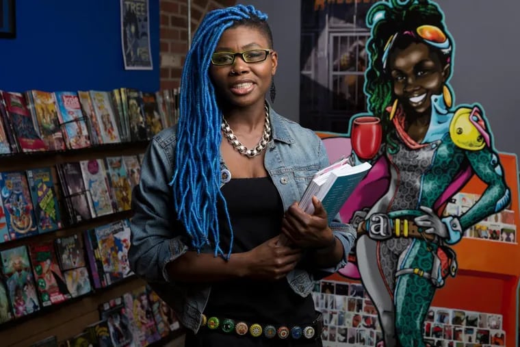 Ariell R. Johnson at her comic book store and coffee shop in Kensington, Amalgam Comics & Coffee Shop. Johnson announced the shop would close in October.