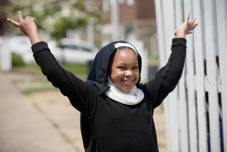 Nia Daniel, 11, at her home in Philadelphia's Lawndale section. A sixth grader at Greene Street Friends in Germantown, Nia is playing Deloris  — the Whoopi Goldberg role  — in the school's spring musical,  "Sister Act Jr." The show's being rehearsed on Zoom and filmed by students from their homes.