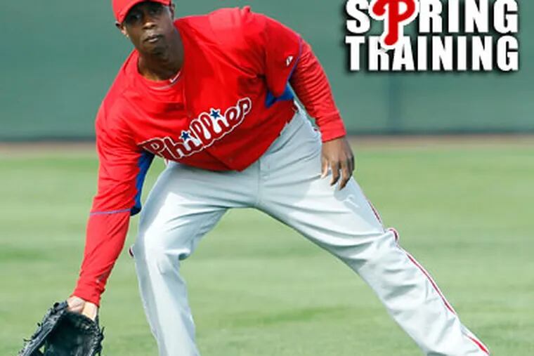 Juan Pierre fields a ball during spring training drills in Clearwater. (Yong Kim/Staff Photographer)