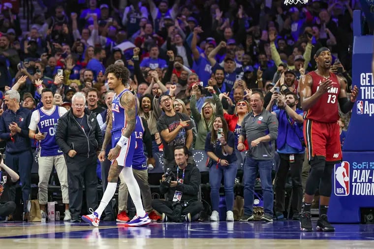 Sixers guard Kelly Oubre Jr. celebrates a made basket against the Heat in front of a fired-up crowd.
