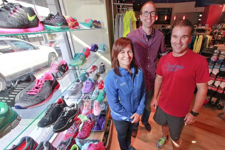 Heather McDanel of Students Run Philly Style and owners Bryan Mahon (right) and Ross Martinson at the Sansom Street store.