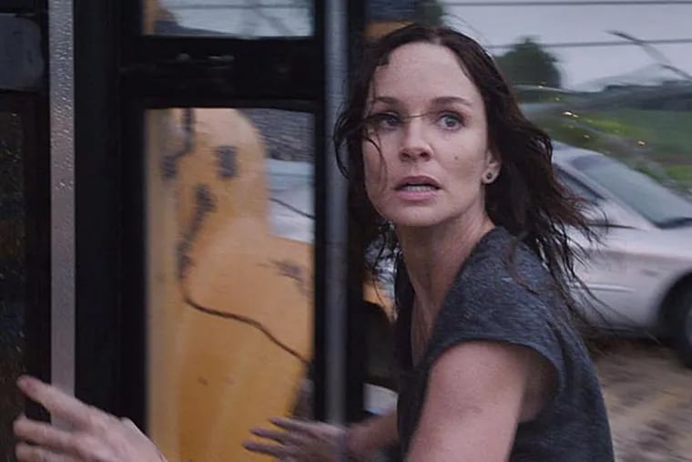 Sarah Wayne Callies chases and faces a storm. (Warner Bros. Pictures)