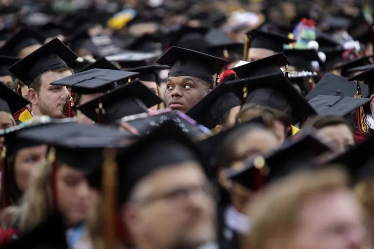 New graduates participate in a Rutgers University graduation ceremony in Piscataway Township, N.J