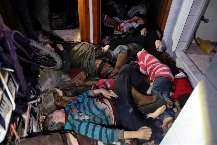 An image released by the Syrian Civil Defense White Helmets shows victims of an alleged chemical weapons attack collapsed on the floor of a building in the rebel-held town of Douma, near Damascus, Syria.