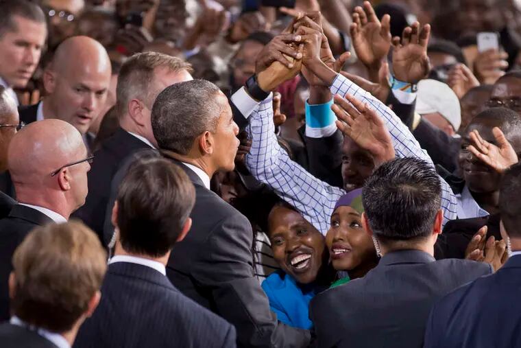 President Obama reaches out to the crowd at the Safaricom Indoor Area in Nairobi, Kenya. His admonishments came across as sage advice given his familial connection. &quot;If it came from another world leader, it might be different,&quot; said one analyst.