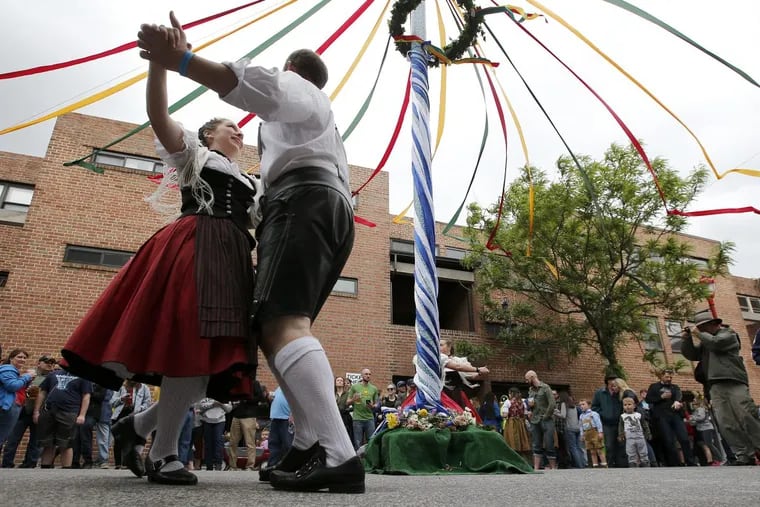 Karina Fricker (left) polka dances with her brother Werner Fricker III during the South Street Headhouse District South Street Spring Festival on Saturday, May 6, 2017. The Fricker's belong to the United German Hungarian Schuhplattlers group.