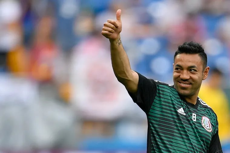 Mexico's Marco Fabian greets supporters during warmup before a 2018 FIFA World Cup game.