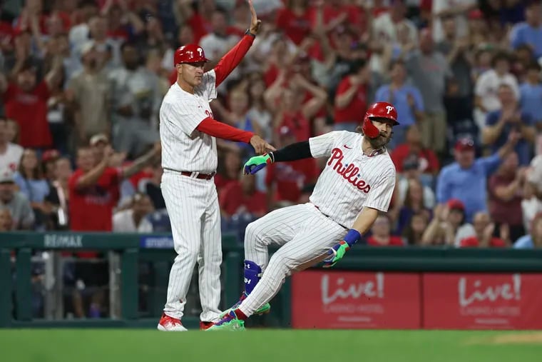 Bryce Harper (right) has had two hits in each of the past four games since switching over to DH, including three home runs and a triple.