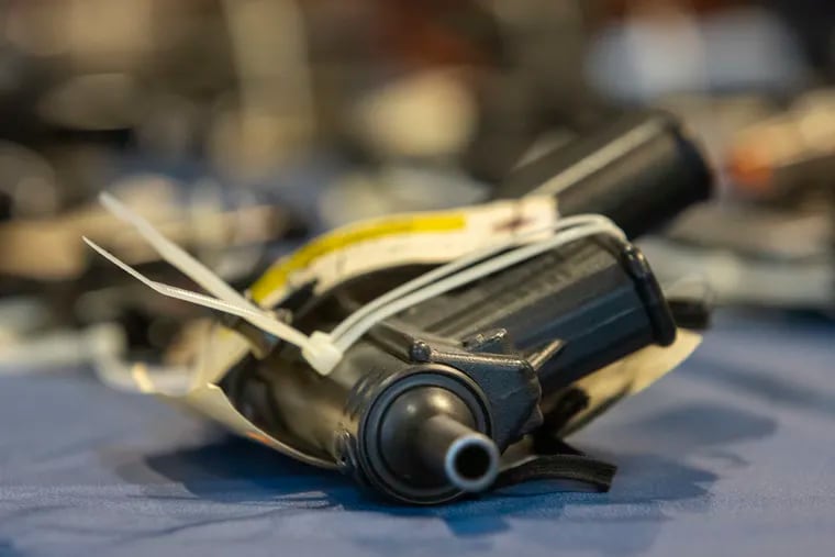 A file photo showing guns seized in April. Guns led to separate shootings of a 1-year-old and a 3-year-old in Philly and Chester County, respectively, over the weekend.