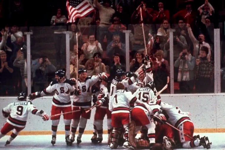 The U.S. men's hockey team pounces on goaltender Jim Craig after a 4-3 victory against the Soviet Union on Feb. 22, 1980 in Lake Placid, N.Y.