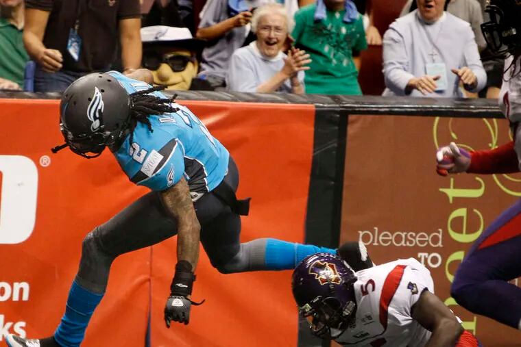 The Soul's Donovan Morgan avoids the tackle of New Orleans' Gladel Brutus to score in the fourth quarter of the Soul's 66-53 win at the Wells Fargo Center.