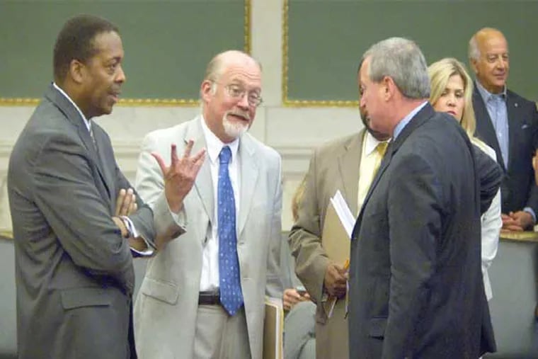 Council President Darrell Clarke, left, talks with fellow councilmen, from left, William Greenlee, Curtis Jones and James Kenney. (Ed Hille / Staff Photographer)