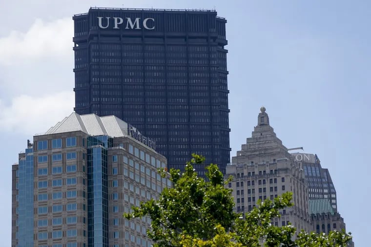 A sign marks the headquarters for UPMC, University of Pittsburgh Medical Center, atop the US Steel tower, in Pittsburgh.