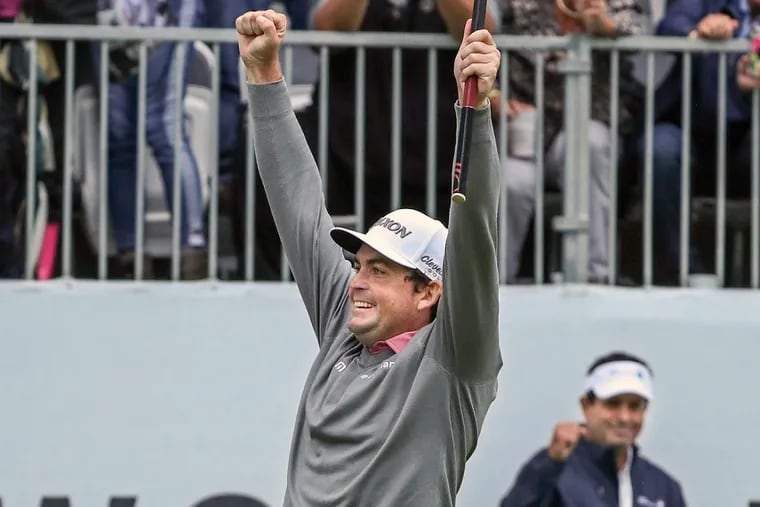 Keegan Bradley celebrates after sinking his par putt on the first hole of the playoff.