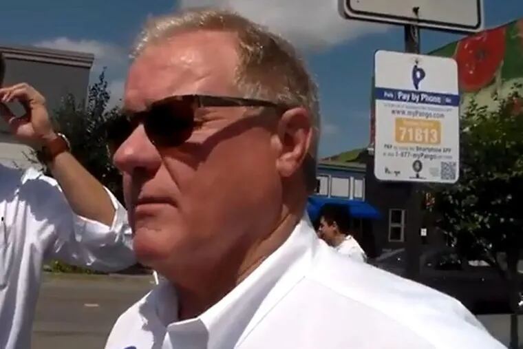 State Sen. Scott Wagner, a York County Republican running for governor, is followed by a video tracker from the state Democratic Party at the Pittston Tomato Festival in Luzerne County.