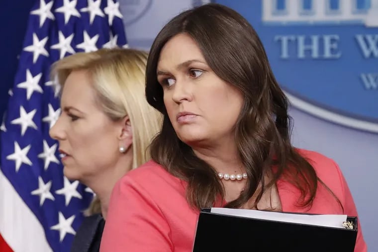 Homeland Security Secretary Kirstjen Nielsen, left, walks past White House press secretary Sarah Huckabee Sanders, right, after speaking to the media during the daily briefing in the Brady Press Briefing Room of the White House, Monday, June 18, 2018.