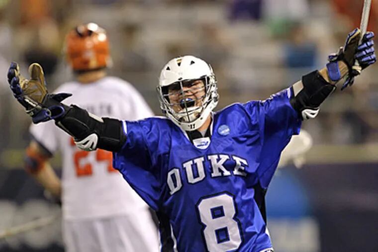Max Quinzani celebrates his game-winning goal over Virginia during Duke's 14-13 win in the NCAA Men's Lacrosse Final Four. (AP Photo/Rob Carr)