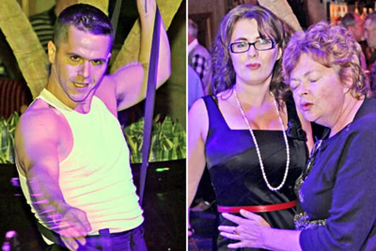 From left, Nicholas "Rocco" Definis, Julia Arikh and Kate Tedder dance at Prohibition. (Tom Briglia / For the Daily News)