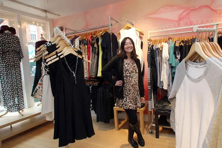 Cortney Cohen, owner of The Geisha House, stands near clothing inside the Old City women's boutique on Wednesday, February 5, 2014. (Yong Kim / Staff Photographer)
