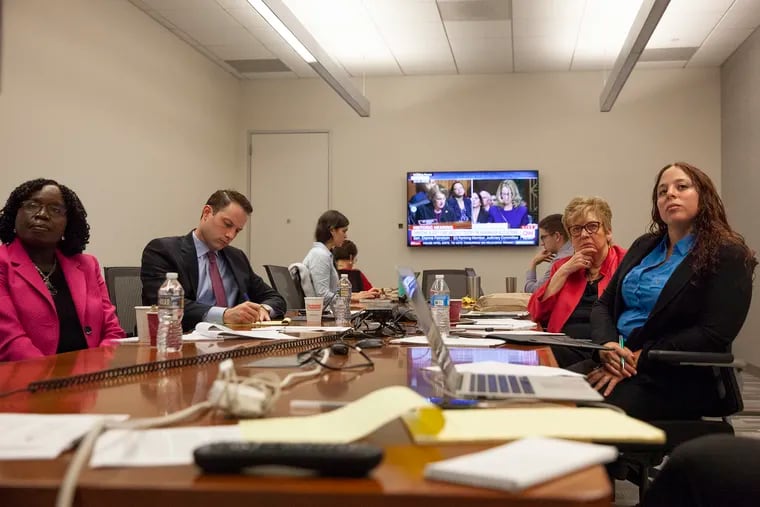 A panel of experts watch as Christine Blasey Ford testifies on Brett Kavanaugh allegations at the Philadelphia Media Network office on Thursday, Sept. 27, 2018.