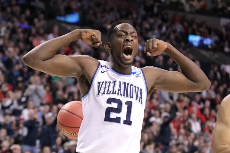 Dhamir Cosby-Roundtree of Villanova celebrates after a Donte DiVincenzo dunk against Texas Tech during the 1st half of the East Regionals of the NCAA Tournament at TD Garden on March 25, 2018.    CHARLES FOX / Staff Photographer