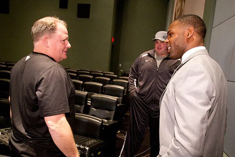 Eagles coach Chip Kelly, left, talks with DeMarco Murray, right, following his press conference on March 12, 2015. (Charles Fox/Staff Photographer)