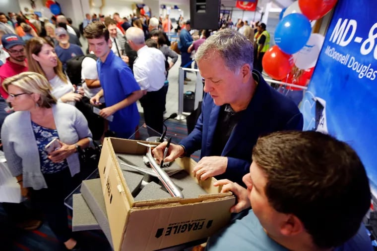 American Airlines CEO Doug Parker signed a model of an American MD-80 for Don Collins of Cleveland. In 2019, Collins flew to join the festivities associated with American's final MD-80 revenue flight, which departed DFW International Airport for Chicago. The airline was retiring its final four MD-80s, which had been in service since the 1980s.