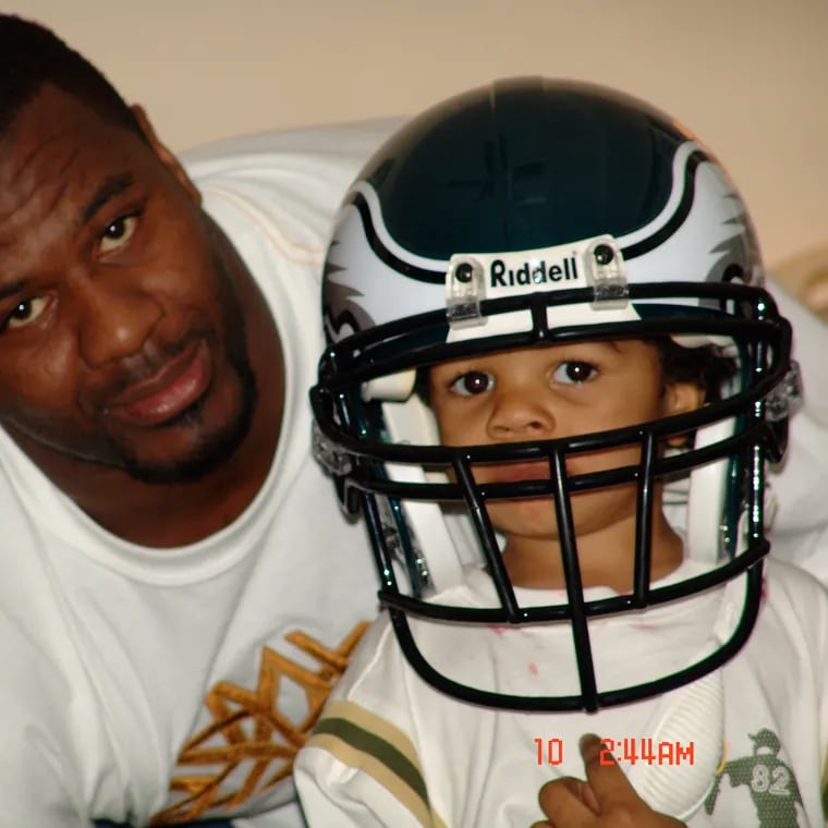 Jeremiah Trotter Jr. tries his dad's Eagles helmet on in Easter of 2005.