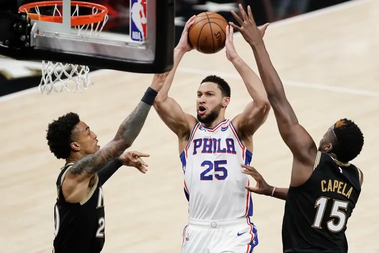 Sixers guard Ben Simmons drives to the basket against Atlanta Hawks forward John Collins and center Clint Capela during the second quarter in Game 6 of the NBA Eastern Conference playoff semifinals on Friday, June 18, 2021 in Atlanta.