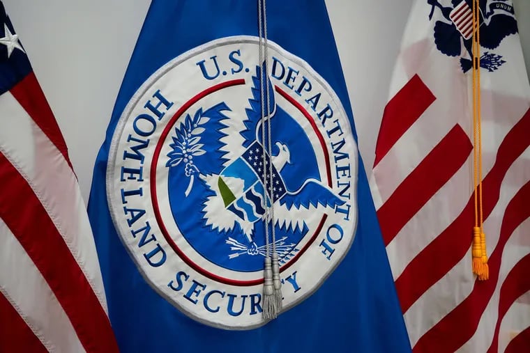 The Department of Homeland Security flag on display before DHS Secretary Kirstjen M. Nielsen speaks at the USBP El Centro Station in San Diego in April 2018. (Nelvin C. Cepeda/San Diego Union-Tribune/TNS)