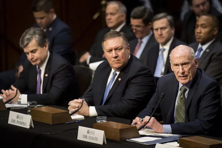 FBI Director Christophe Wray, CIA Director Mike Pompeo and Director of National Intelligence Daniel Coats testify before the Senate Intelligence Committee on Feb. 13.