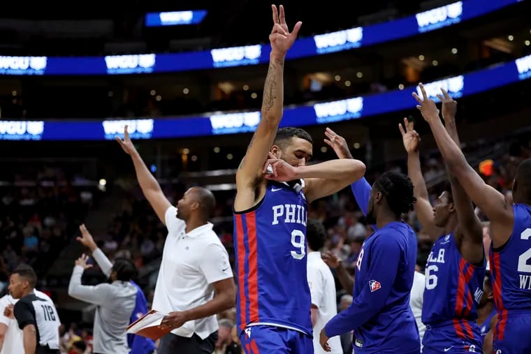 Philadelphia 76ers' Trevelin Queen (9) and teammates celebrate a 3-pointer against the Utah Jazz during an NBA summer league basketball game in Salt Lake City on Wednesday, July 6, 2022. (Scott G Winterton/The Deseret News via AP)