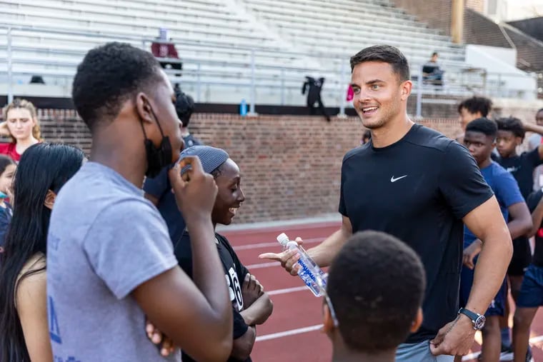 Eagles wide receiver Devon Allen (right) met with kids from Penn's Young Quakers Community Athletics at Franklin Field on Thursday, a week before the start of the Penn Relays.
