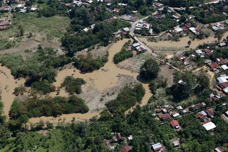 Floodwaters brought by Tropical Storm Eta begins to recede on the outskirts of Coban in northern Guatemala on Tuesday.